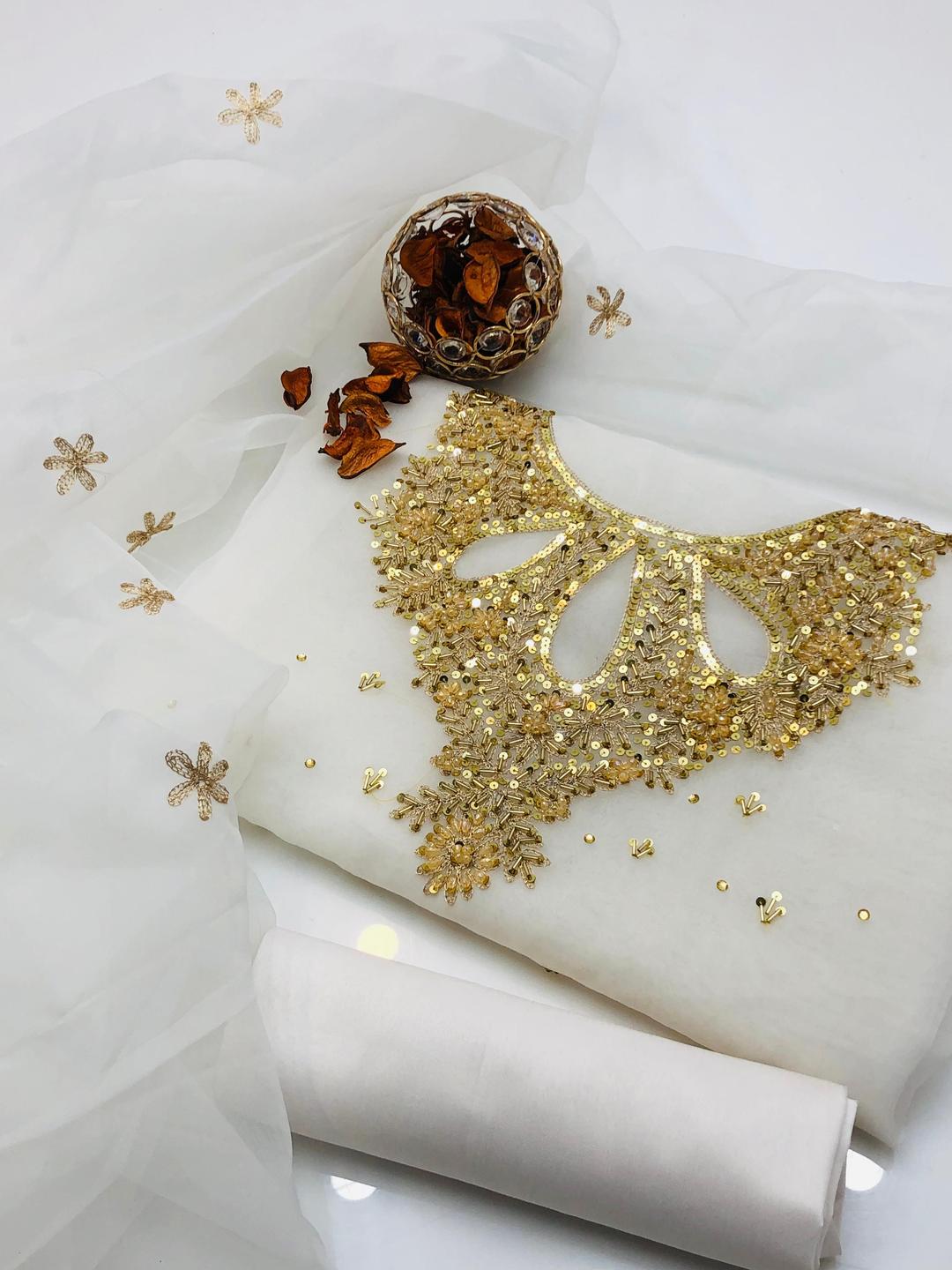 3 Pcs Women unstitched Embroidered suit.